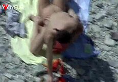 Curvy milf enjoys beach activities in public