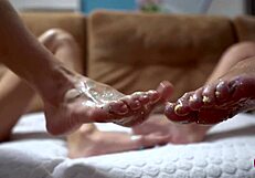 Two Cuties With Shiny Legs Tease With a Huge Rubber Cock in Footjob Play