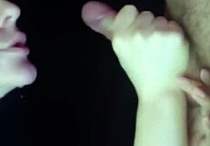 A girl sucks dick from the inside of the mouth, showcasing passionate close-ups