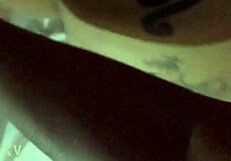 Tattooed blonde bends over in bold pose