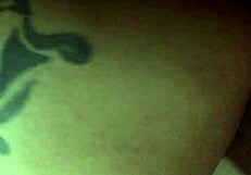 Tattooed blonde bends over in bold pose