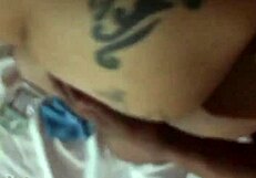 Tattooed blonde bends over in bold pose