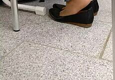 Enjoying shoeplay and dipping in tan nylons with flats