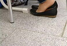 Enjoying shoeplay and dipping in tan nylons with flats