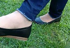 Enjoying shoeplay and dipping in tan nylons with flats