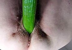 oma uses dildo and cucumber in her hairy spot for wild fun.