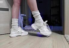 delicate legs in sneakers waiting