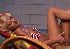 Does the blonde slut tease with her feet?