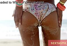 sexy beach hottie in bikini shows off her curves