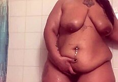 In the Shower, a Whore with Fresh Face and Bare Ass Uses Dildo to Fuck Wet Pussy to Orgasm