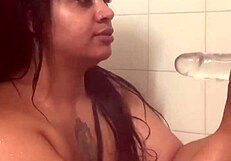 In the Shower, a Whore with Fresh Face and Bare Ass Uses Dildo to Fuck Wet Pussy to Orgasm