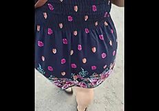 curvy mature woman walks street in skirt