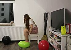 Girl playing with balloons while wearing pantyhose