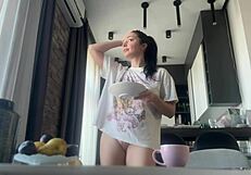 Why does the sexy fit brunette do housework without panties, flashing her shaved pussy and big ass?