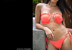 Sindy models her orange swimsuit