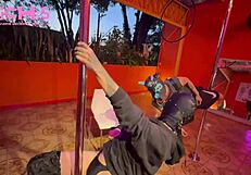 Tattooed beauty dances on pole for audience