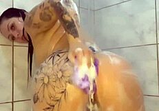 watched this tattooed brazilian housewife dance then play with her small tits and ass under shower 😏