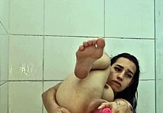 young brunette flashes tits and gapes ass in homemade bath solo