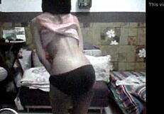 Asian Filipina's teasing striptease with ripped clothes and small tits