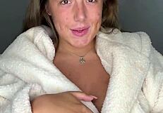 Blonde tries on lingerie at home in homemade video.