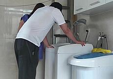 wow, the housewife is totally teasing the repair guy fixing her washing machine, isn't she wild?
