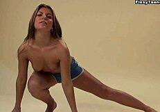 Alena, the flexible Croatian gymnast, spreads her legs and stretches to arouse