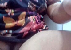 On the beach, she fingers her wet pussy under the sun.