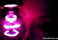 Samantha Saint enjoys lesbian oral with big tits under black light