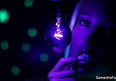 Samantha Saint enjoys lesbian oral with big tits under black light