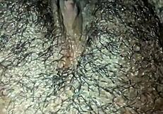 This ebony girl is playing with her hairy pussy