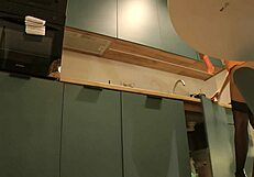 A cute housewife flashes her panties while wearing high heels and stockings in a mini skirt.