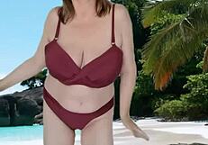 Hot granny showing off huge tits in tiny bikini