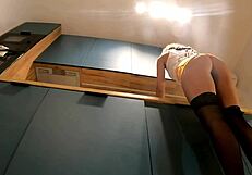 A cute housewife flashes her panties while wearing high heels and stockings in a mini skirt.