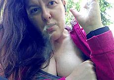 Nicoletta Smokes In A Public Garden And Teasingly Shows Her Big Tits