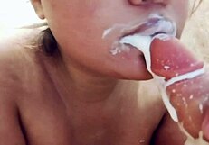 Sucking on big realistic messy milk dildo closeup