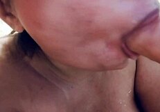 Sucking on big realistic messy milk dildo closeup