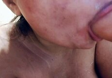 Sucking on big realistic messy milk dildo closeup