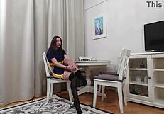 Evelyn trying on black and tan pantyhose