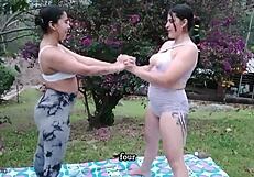 Latina lesbians practicing yoga together