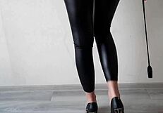 dominatrix in tight leggings