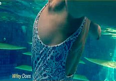 preview - wife swimming in the hotel pool in a hot one piece