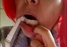 Chantal demonstrates proper tooth brushing and filling mouth with toothpaste in close up