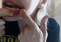 Chantal demonstrates proper tooth brushing and filling mouth with toothpaste in close up