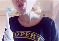 Chantal demonstrates proper tooth brushing and filling mouth with toothpaste in close up