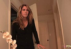 Blonde intruder leads brunette to bedroom for intimate exploration.