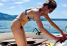 beautiful blonde housewife washes the boat in her sexy thong swimsuit this summer