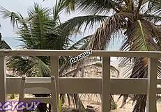 Hey, that ebony wife is flashing her pussy right at the beach house, feeling so bold outdoors