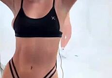 Boutinela shows off in all black bikinis, focusing on her ass.