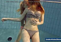 Horny girls strip each other in the pool, ripping clothes