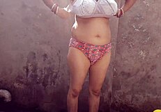 Bhabhi bathing outdoors naked.